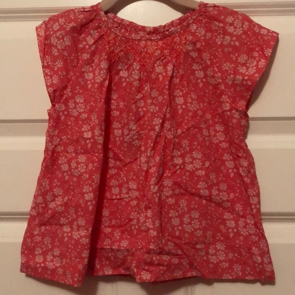 Jacadi girl top, orange with white flowers, ornamental stitched neck, size 6